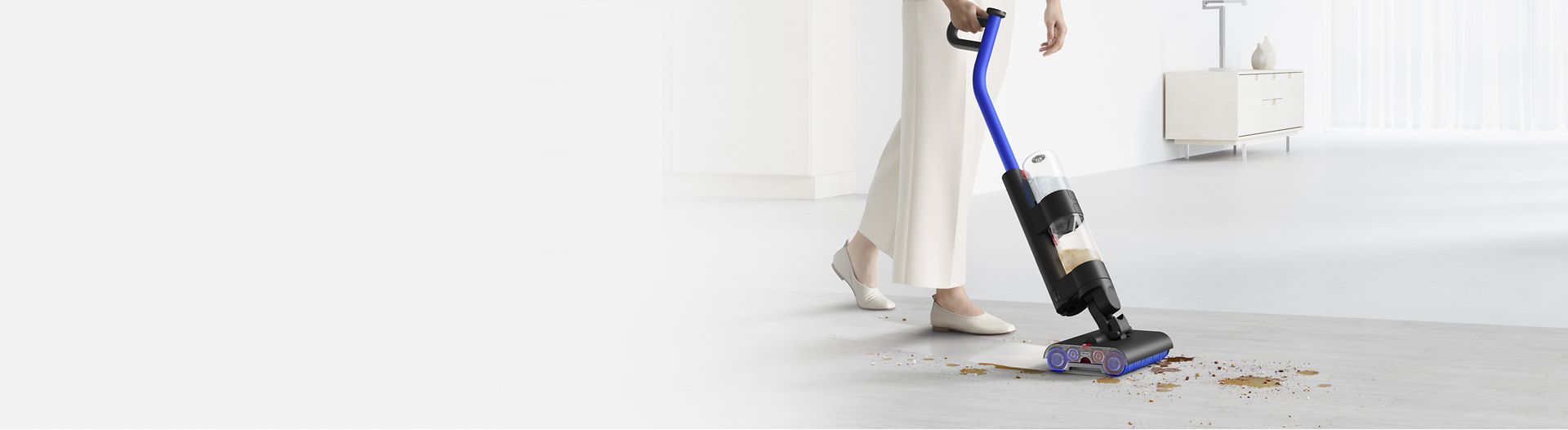 The Dyson Wash G1 wet floor cleaner cleaning spills and debris