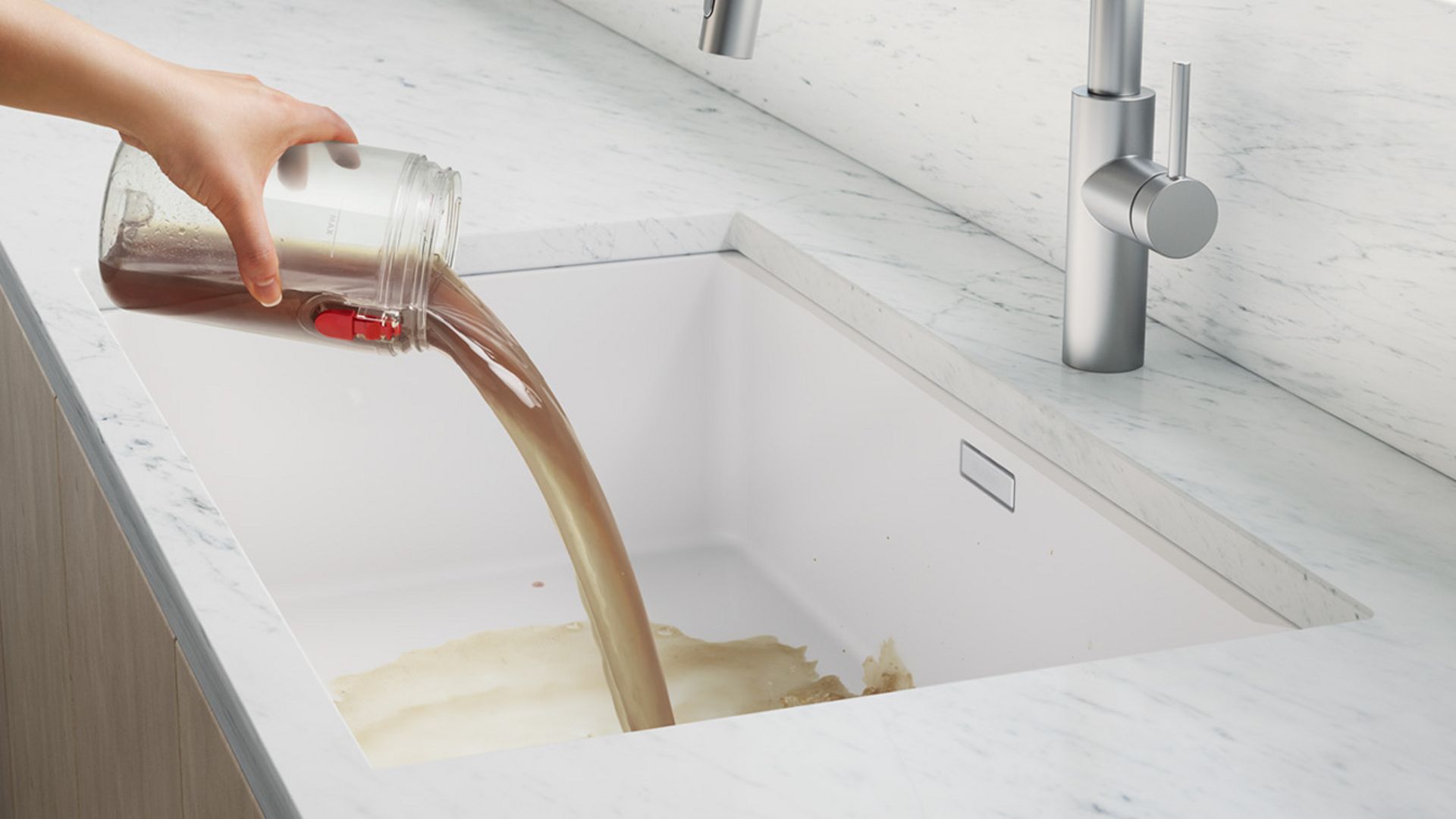 Emptying the dirty water tank into a sink. Emptying the dirty water tank into a sink.