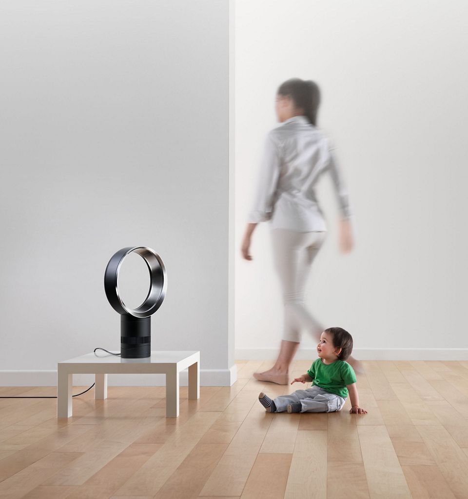 Dyson fan on table with child and woman
