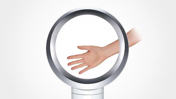 Hand entering Dyson Pure Cool™ desk fan