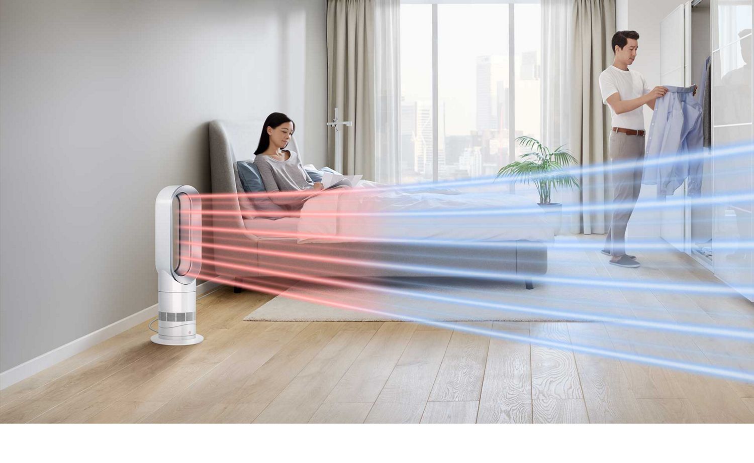 Dyson Hot+Cool Jet Focus fan heater circulates air throughout a bedroom to heat and cool a couple.