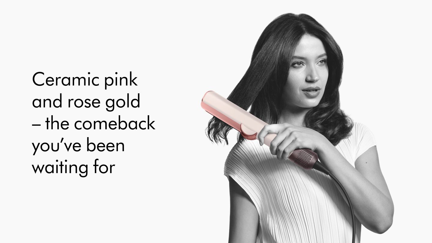 A Dyson Airstrait straightener in use. Ceramic Pink and rose gold - the comback you've been waiting for