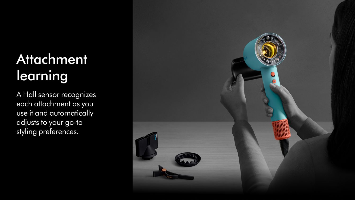 The Dyson Supersonic Nural hair dryer being held in order to attach various Intelligent attachments.