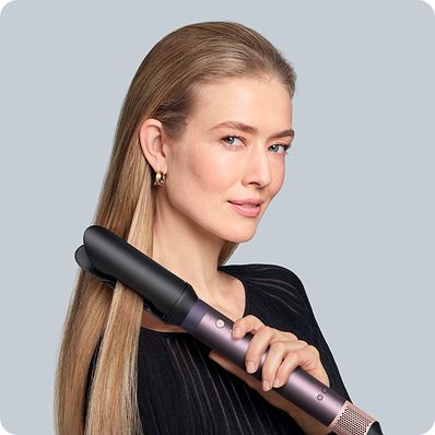 The Dyson Airwrap Co-anda2x and the AirSmooth2x attachment straightening blonde hair