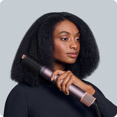 The Dyson Airwrap Co-anda2x multi-styler and dryer lengthening and straightening hair