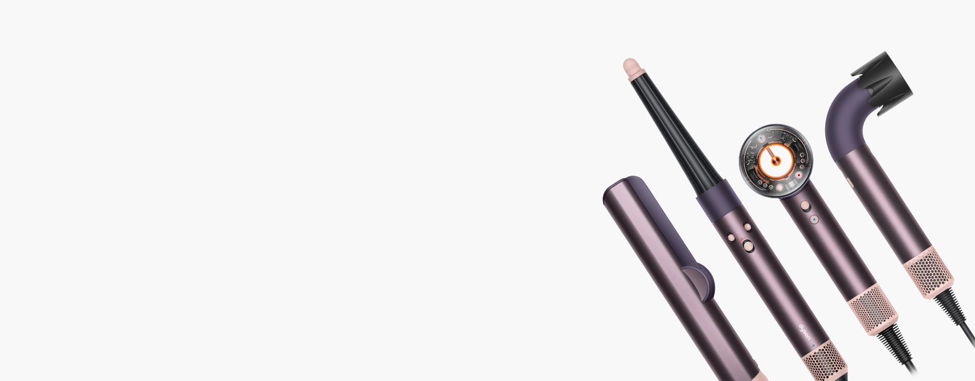 A line-up of Dyson hair care machines, in Jasper plum.