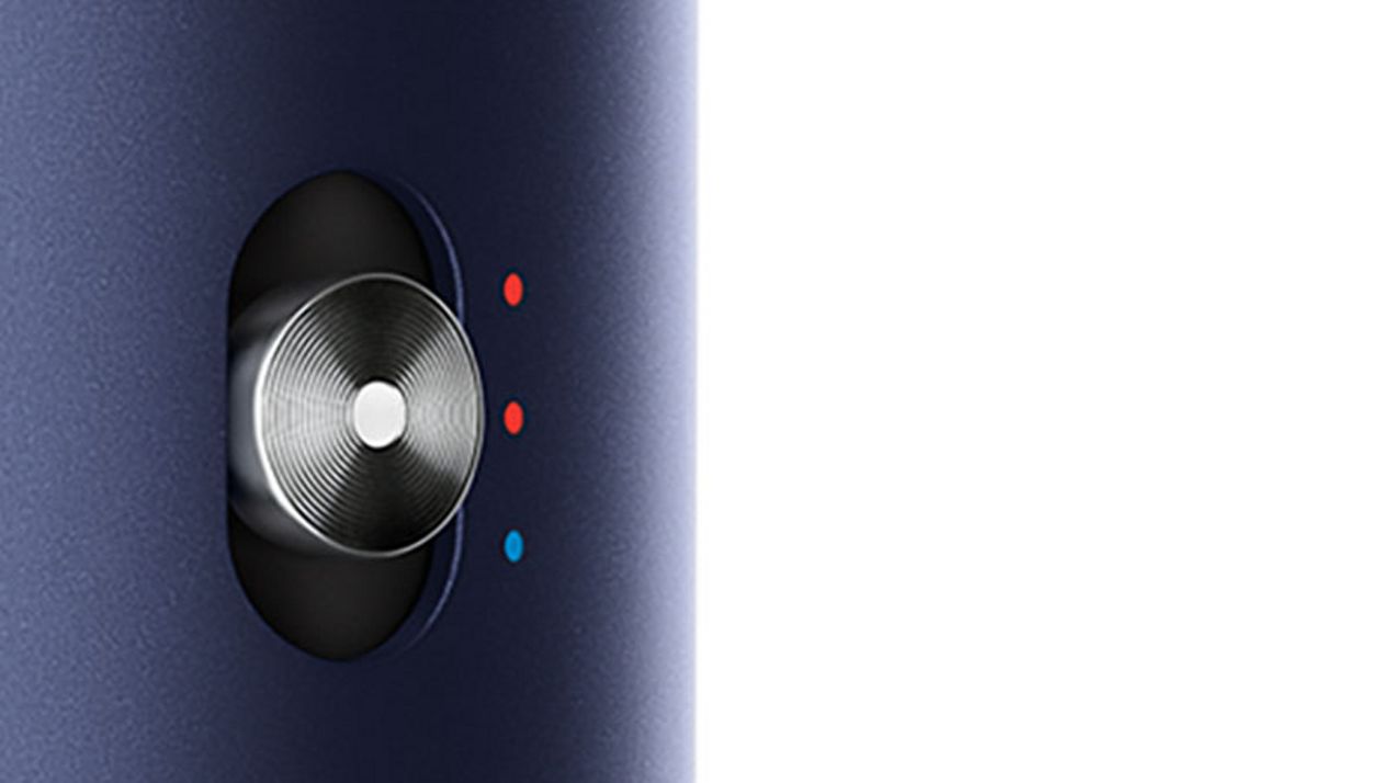 Close do botão de controle de aquecimento no Dyson Airwrap Close do botão de controle de aquecimento no Dyson Airwrap