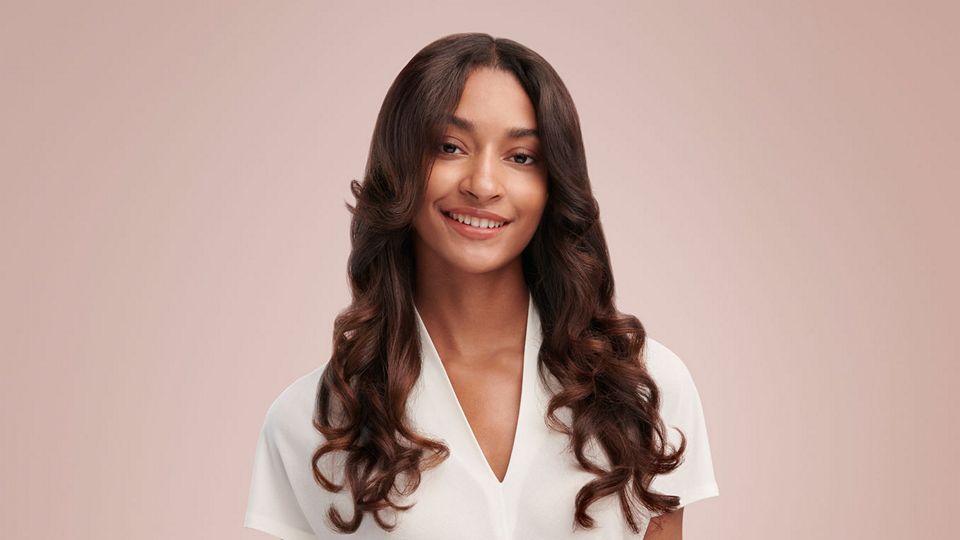 Model with a curly blow out style