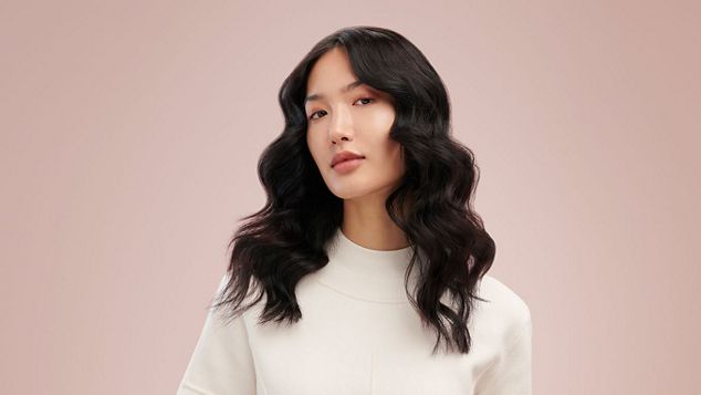 Model wearing loose mermaid waves