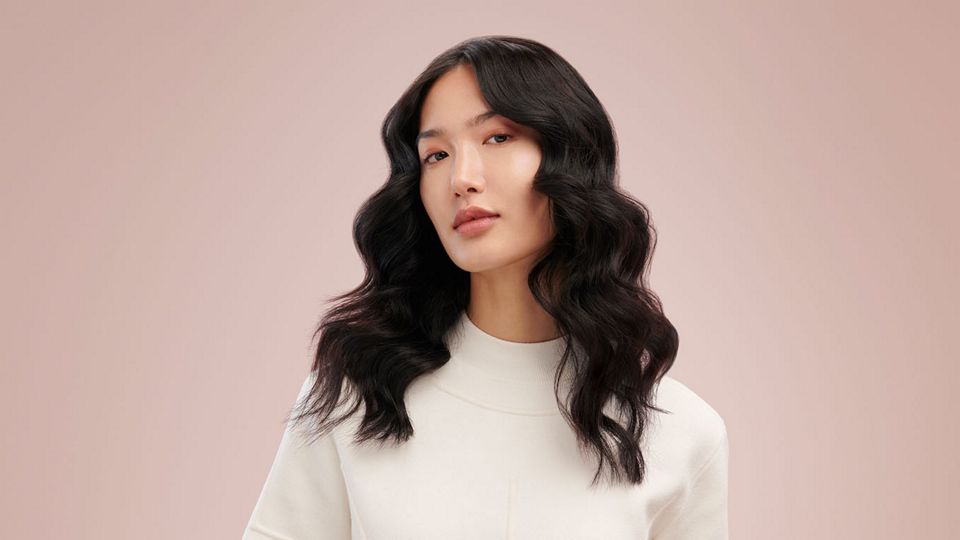 Model wearing loose mermaid waves