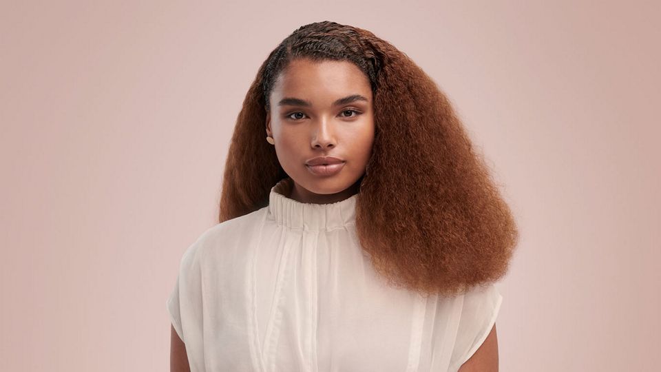 Model wearing a stretched blow out style
