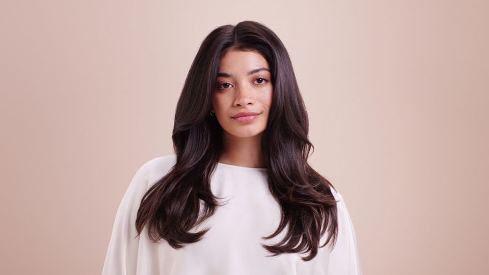 Model wearing loose mermaid waves.
