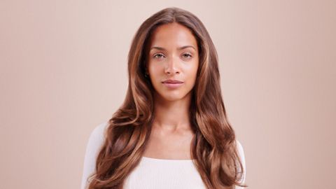 Model wearing loose mermaid waves.