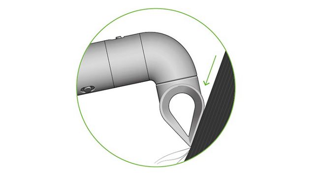 The Blade concentrator attachment angled down a section of hair.