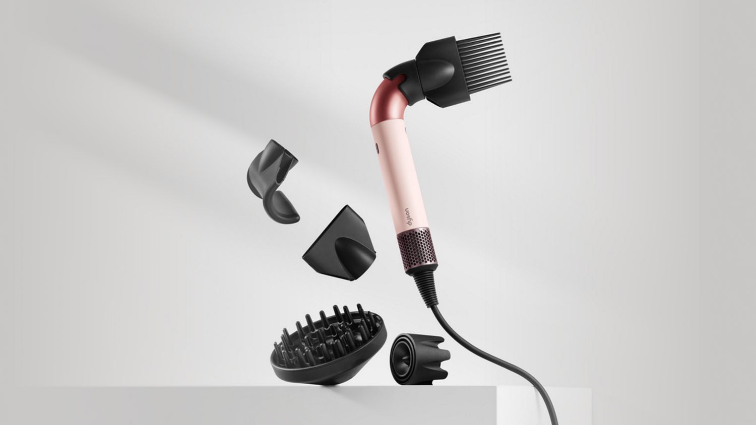 The Dyson Supersonic r hair dryer with a range of attachments.