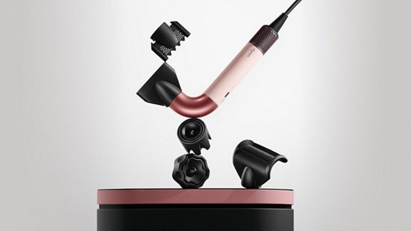 The Dyson Supersonic r hair dryer with a range of attachments.