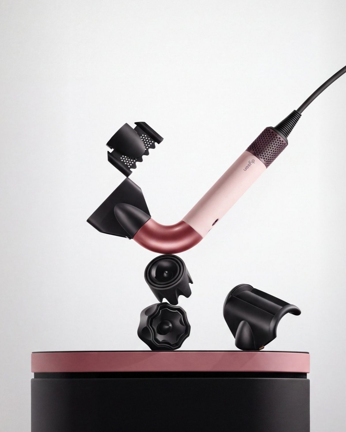 The Dyson Supersonic r hair dryer with a range of attachments.