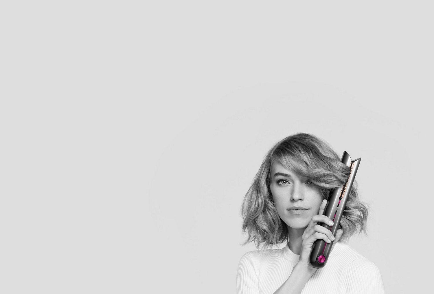 Model using the Dyson Corrale straightener