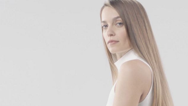 Model with dark, straight, smooth hair.