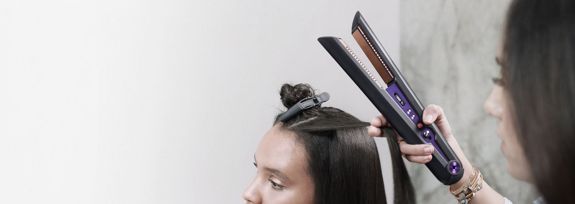  Dyson Corrale straightener being used by a hair stylist