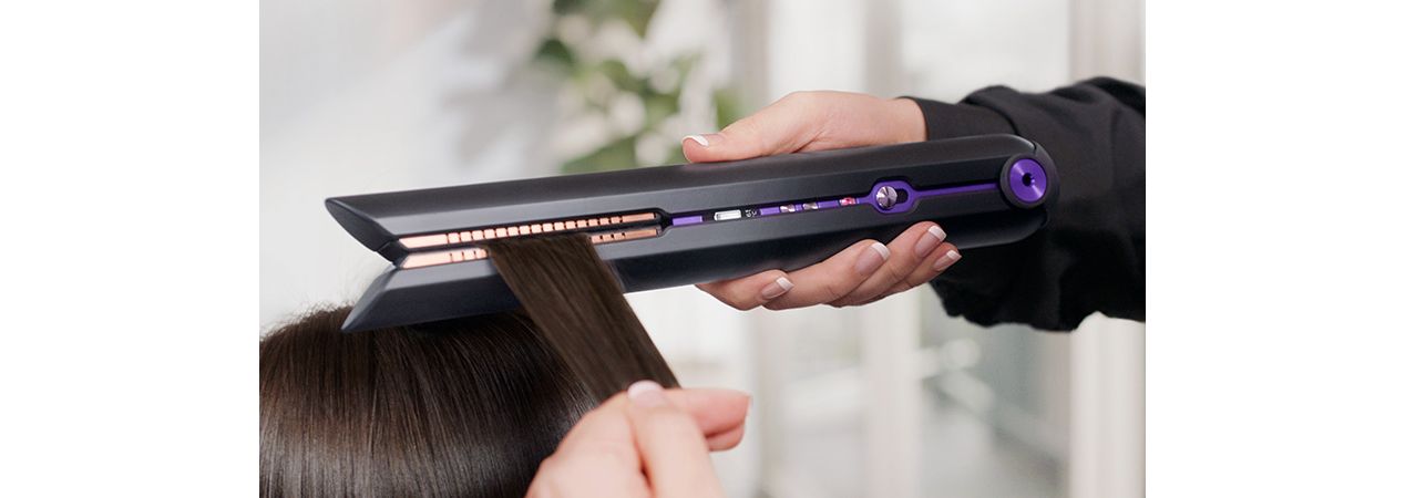 Dyson Corrale hair straightener gathering hair by the flexing plates