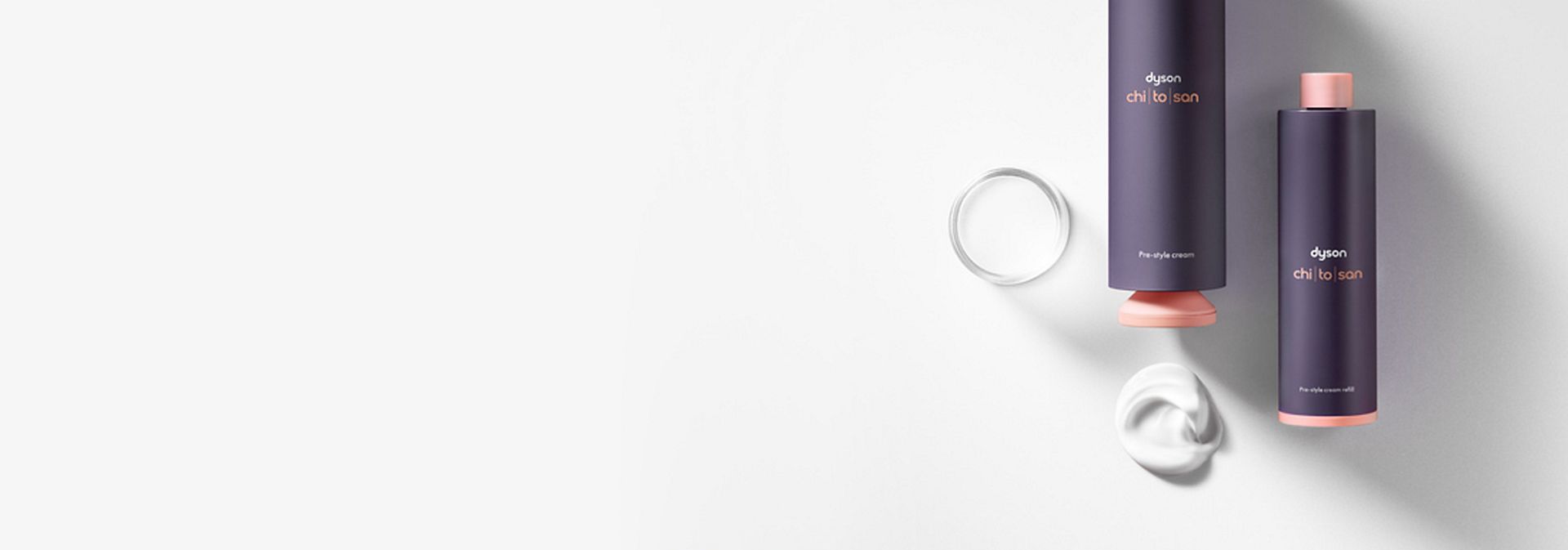 Dyson Chitosan Pre-style-krem i 100 ml ved siden av en refillpatron.