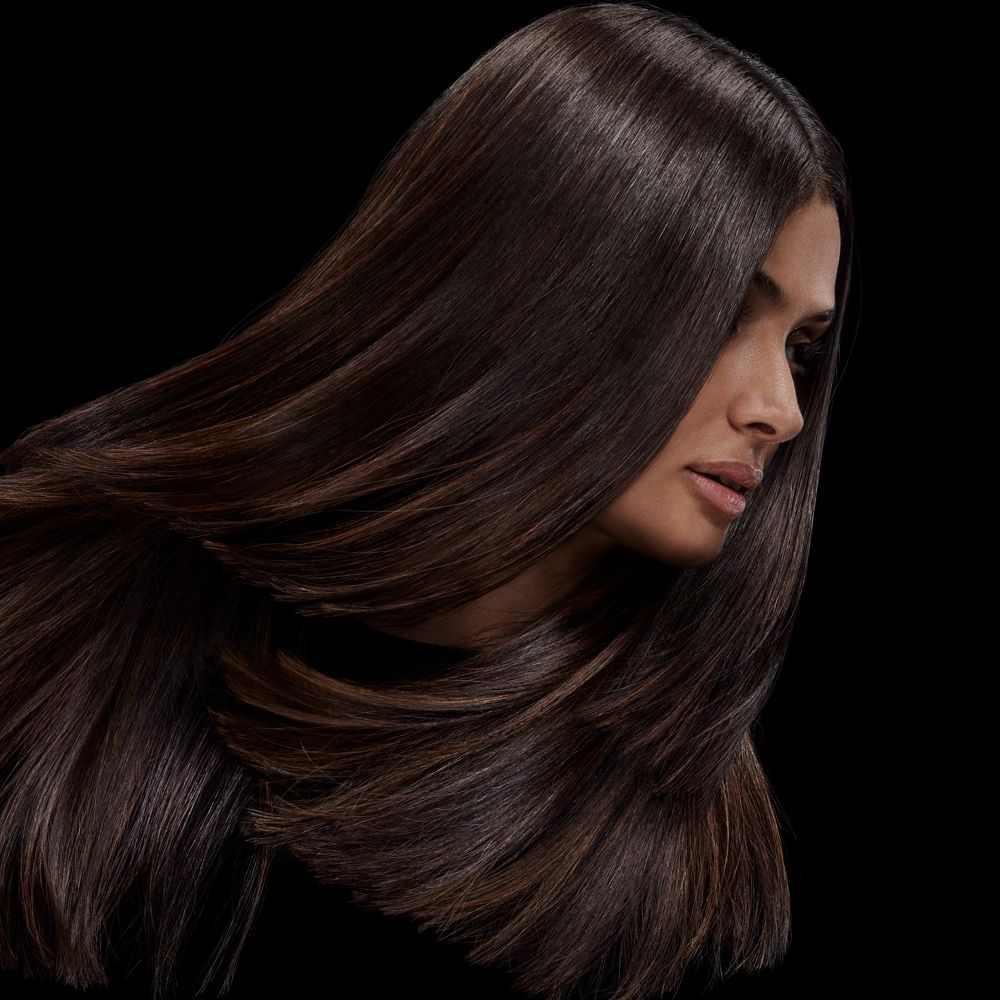 A model with shiny brunette hair.