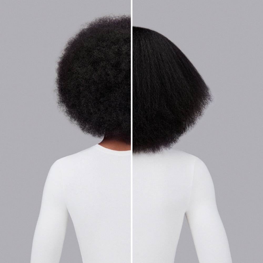 A before and after of a woman with coily hair styled with Dyson Chitosan Pre-style cream.