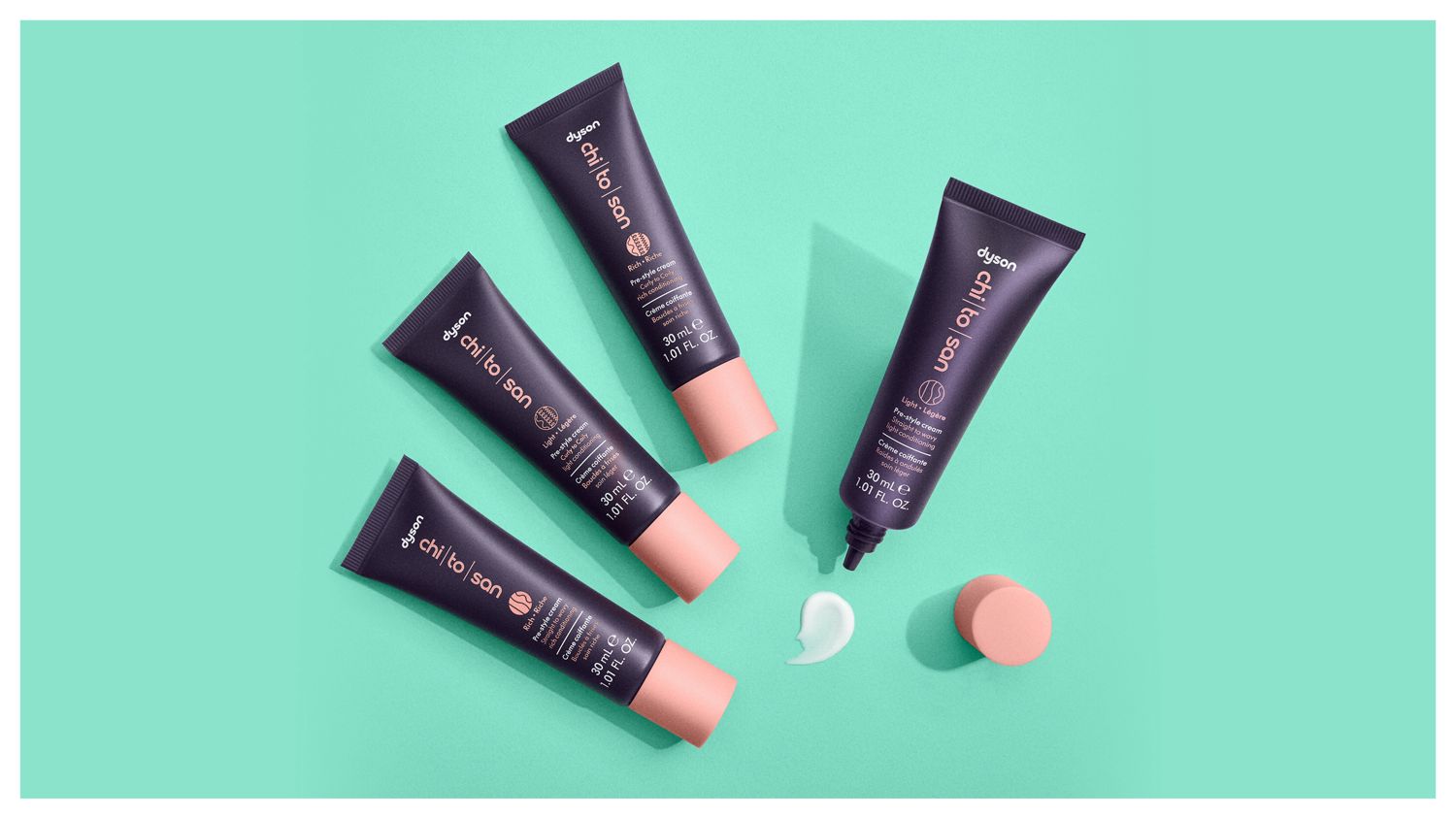 The Dyson Chitosan Pre-style cream range in 30ml sizes laid on a surface.