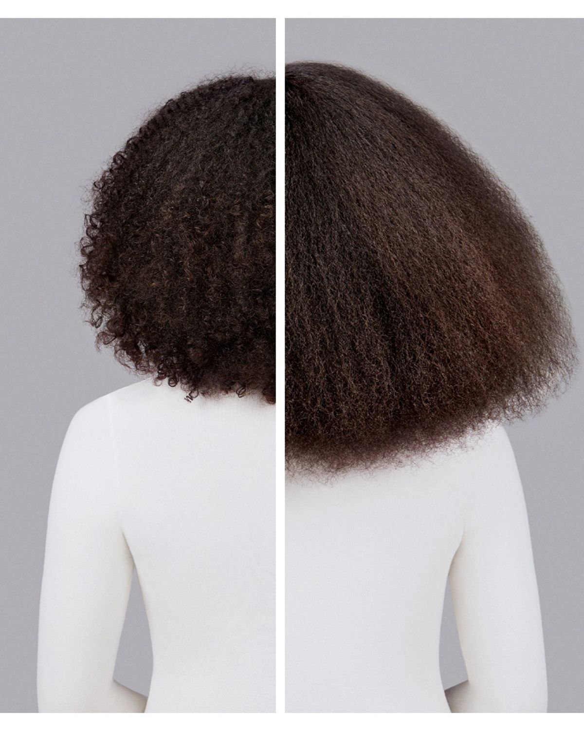 Naturally coily dark brown hair styled with Dyson Chitosan Pre-style cream and the Dyson Supersonic Nural. Seen from behind.