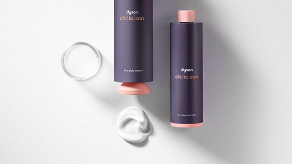 The Dyson Chitosan Pre-style cream full-size product next to a refill cartridge.