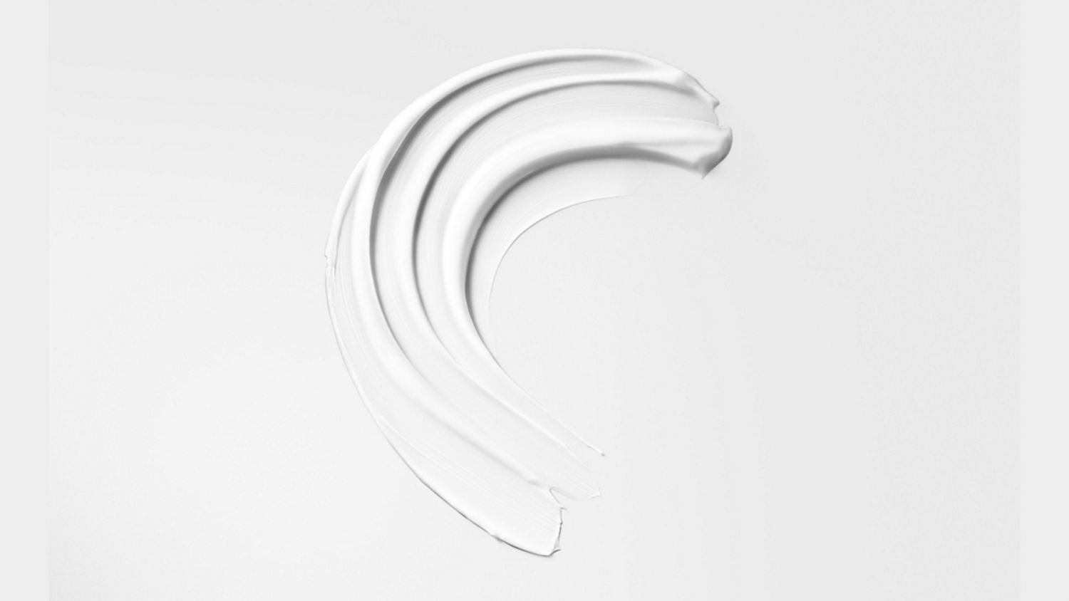 Dyson Chitosan Post-style serum spread on a surface.