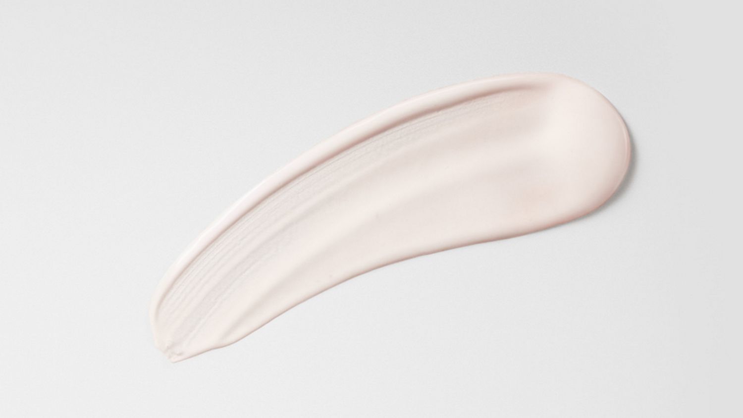 Dyson Chitosan Post-style serum spread on a surface.