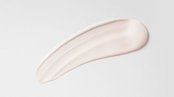 Dyson Chitosan Post-style serum spread on a surface.