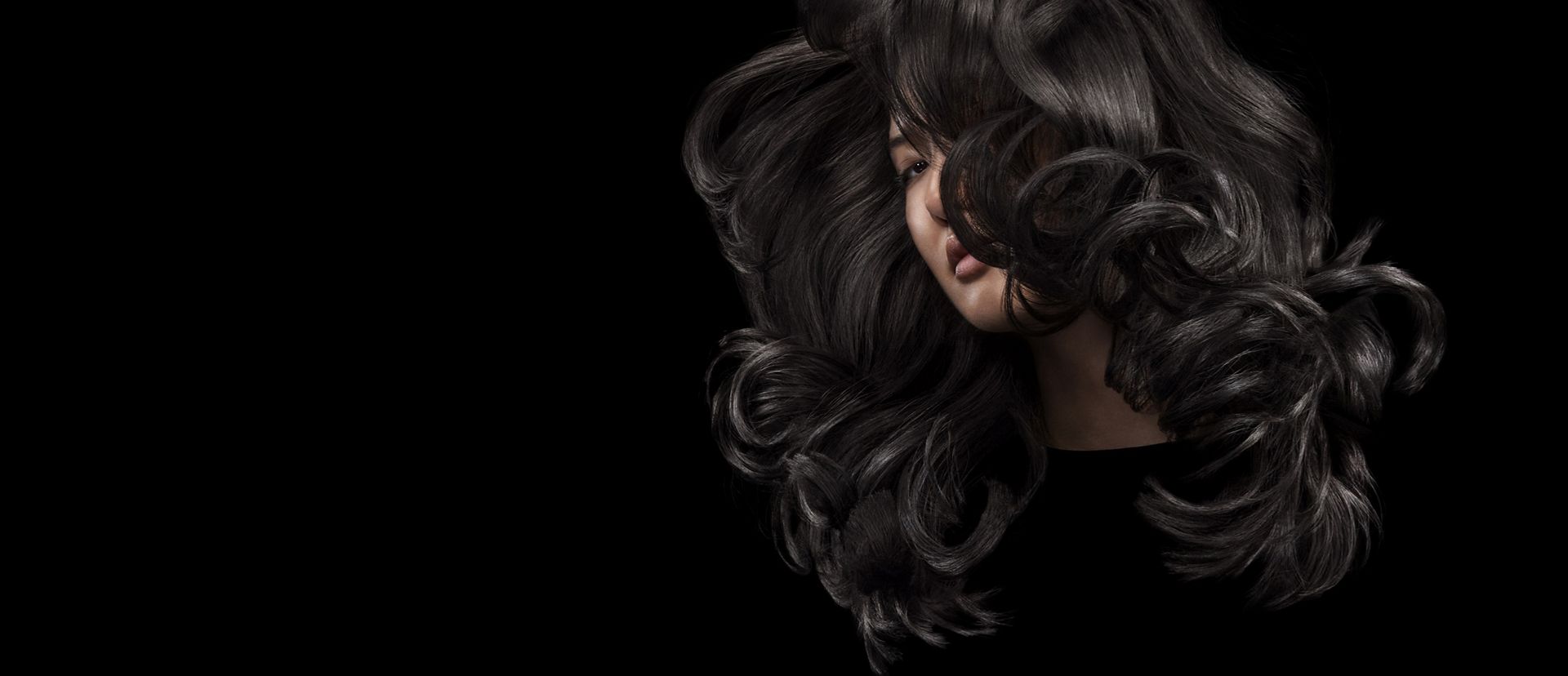 Model swishing her long, styled hair