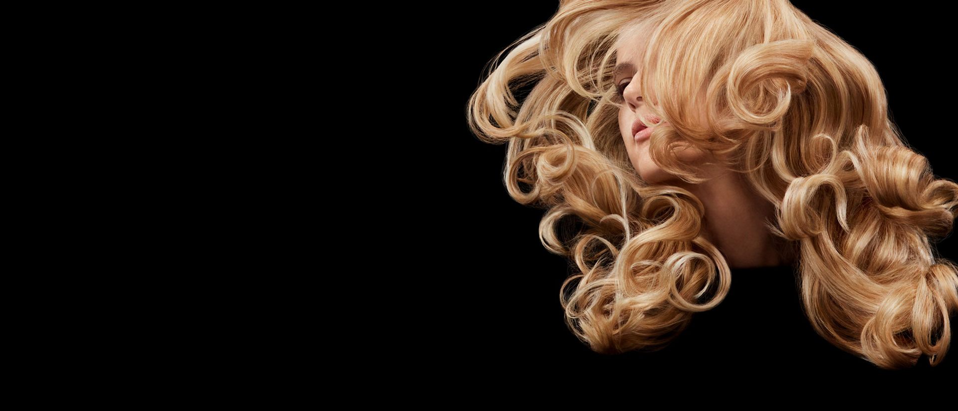 Model swishing her long, styled hair