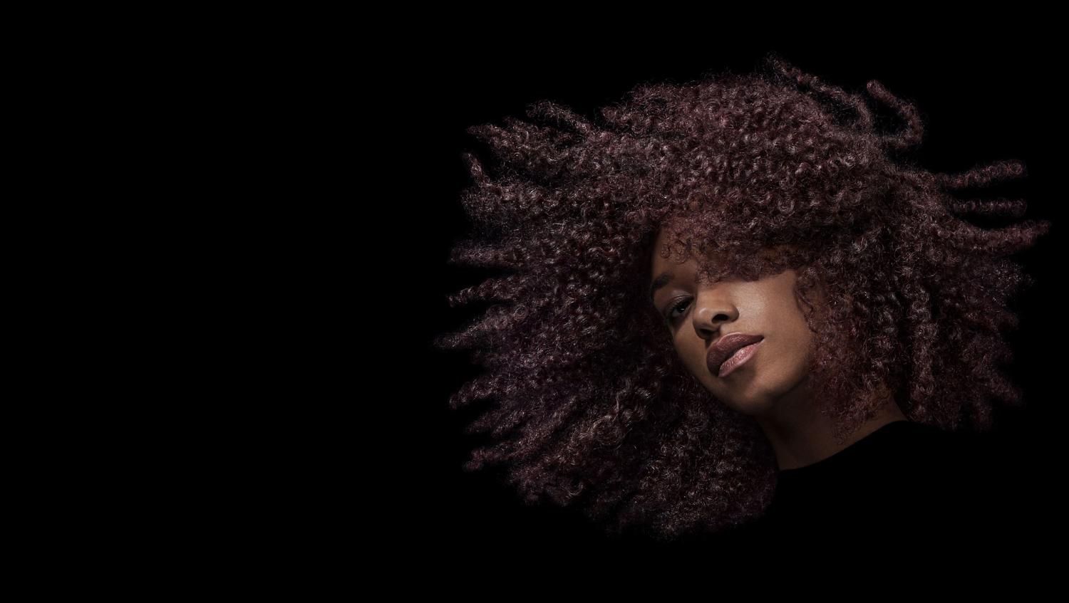 Model swishing her long, styled hair