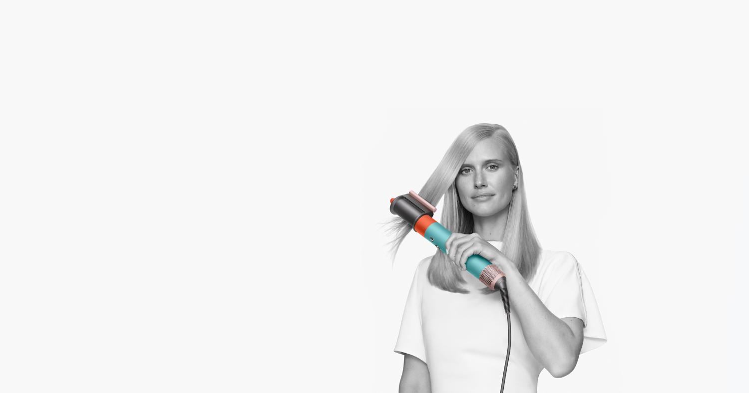 Model using Dyson Airwrap multi-styler