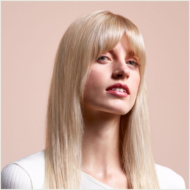 A model with long, blonde hair wearing a straight style.