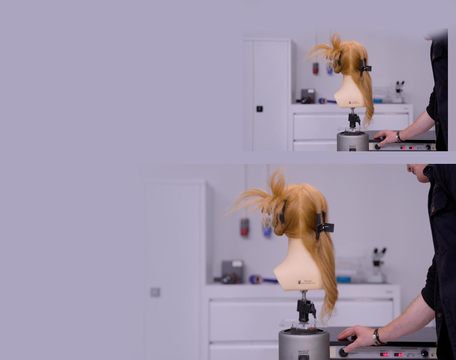 A Dyson engineer in a laboratory with hair mannequin wearing a Wide hair clip.