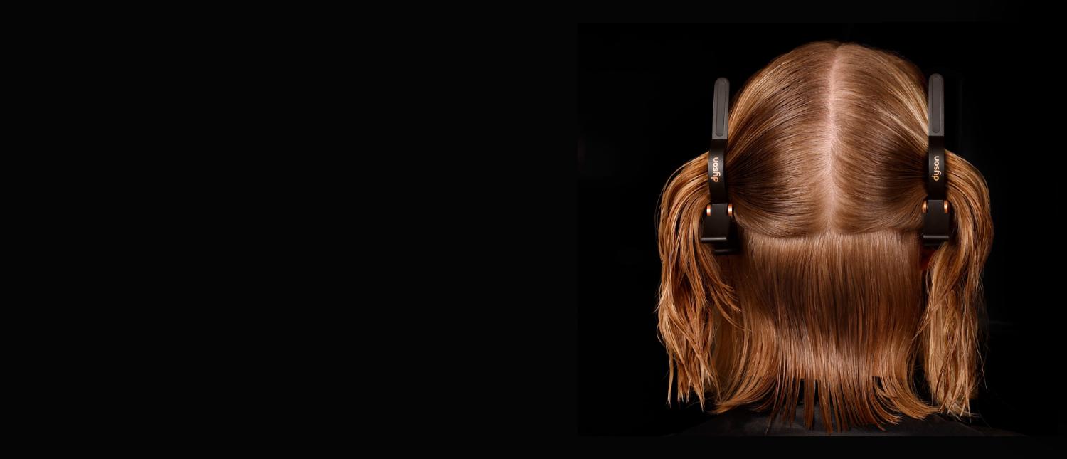A model with two Sectioning hair clips parting her hair