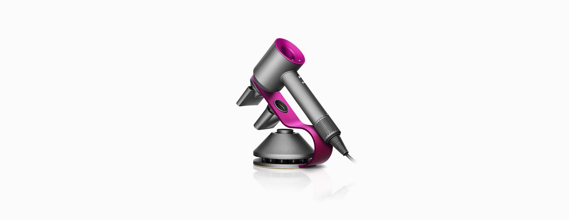Fuchsia and Iron Dyson Supersonic™ hair dryer stand with Supersonic hairdryer