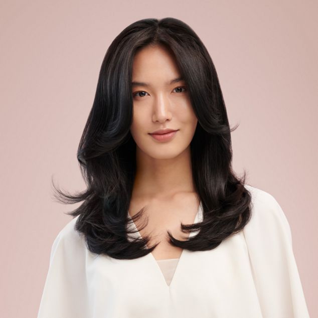 Model with a curly blow out style