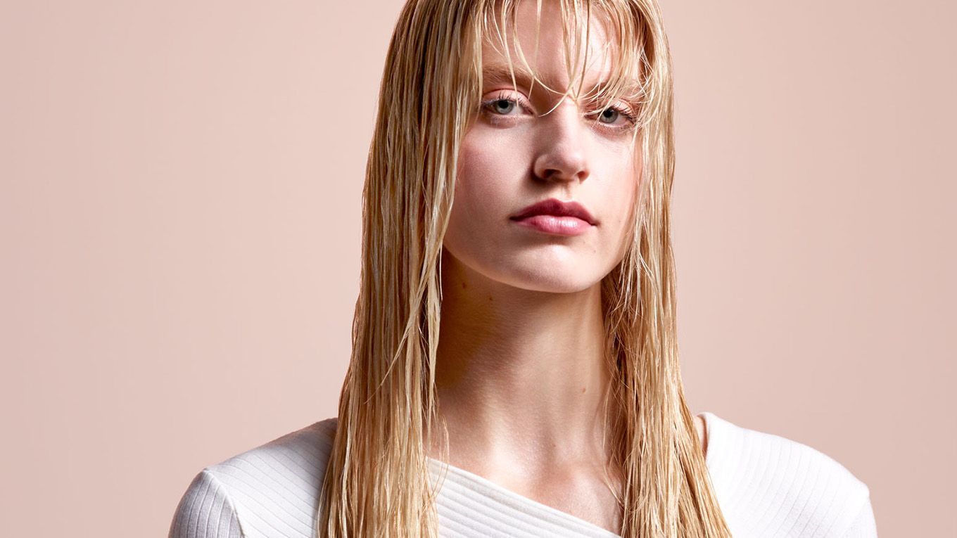 Model with long, blonde, wet hair. Long, blonde, wet hair.