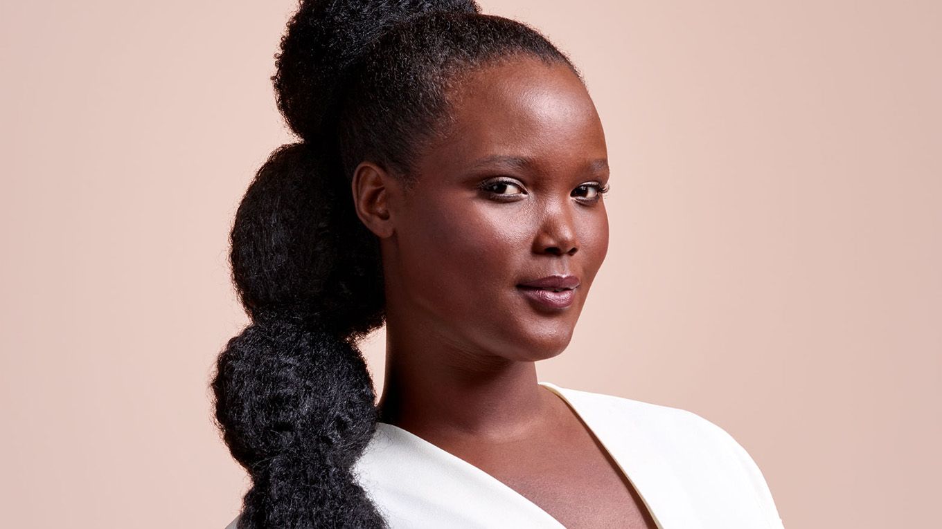 A model with long, black hair, worn in a stretched bubble puff ponytail. A model with long, black hair, worn in a stretched bubble puff ponytail.