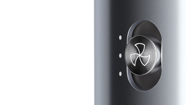 Close up of professional stylist using a cordless Dyson Corrale hair straightener