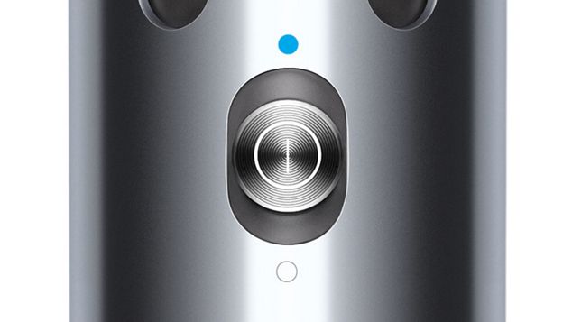 Professional stylist using a Dyson Corrale hair straightener