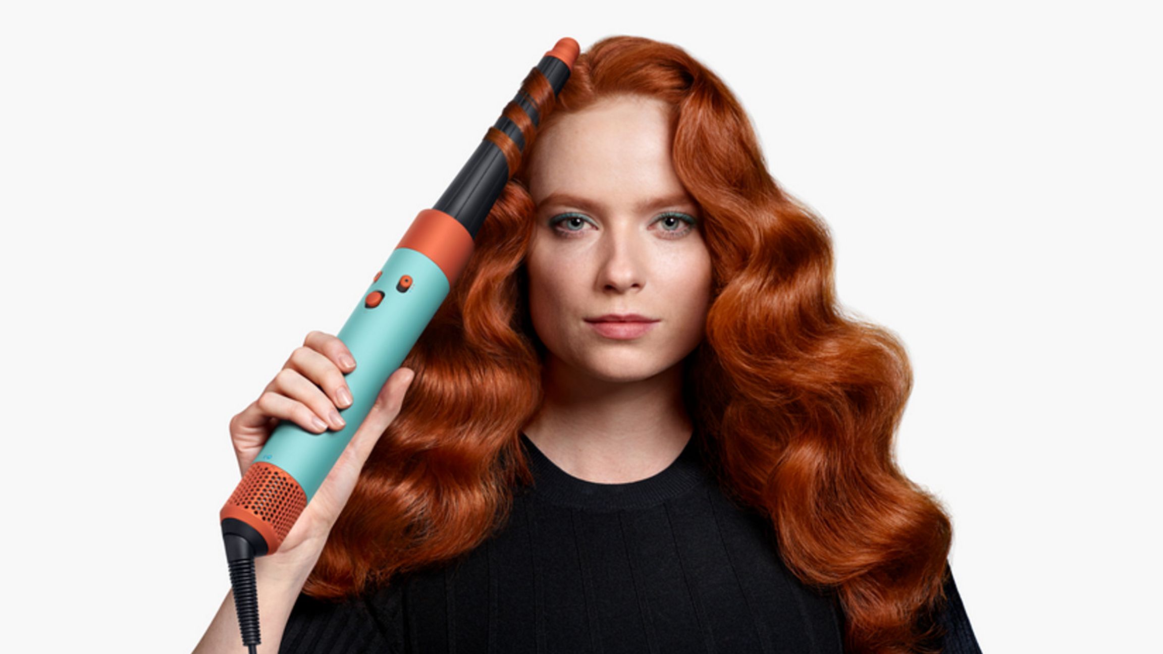 A model using the Ceramic Patina Dyson Airwrap i.d multi-styler and dryer to add waves to their hair.