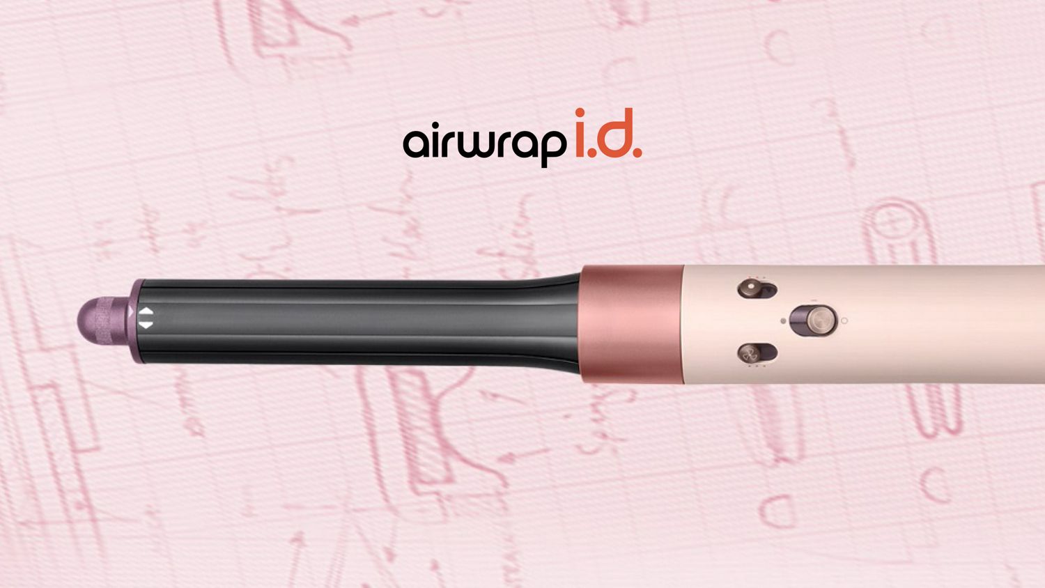 The Dyson Airwrap ID in front of pink engineering sketches.