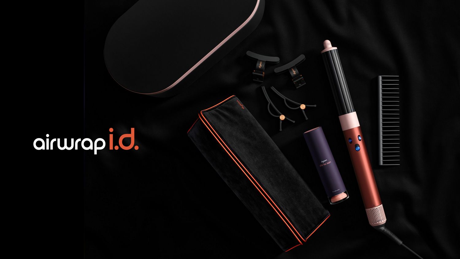 Dyson Airwrap ID with attachments laid out in front of the presentation case.